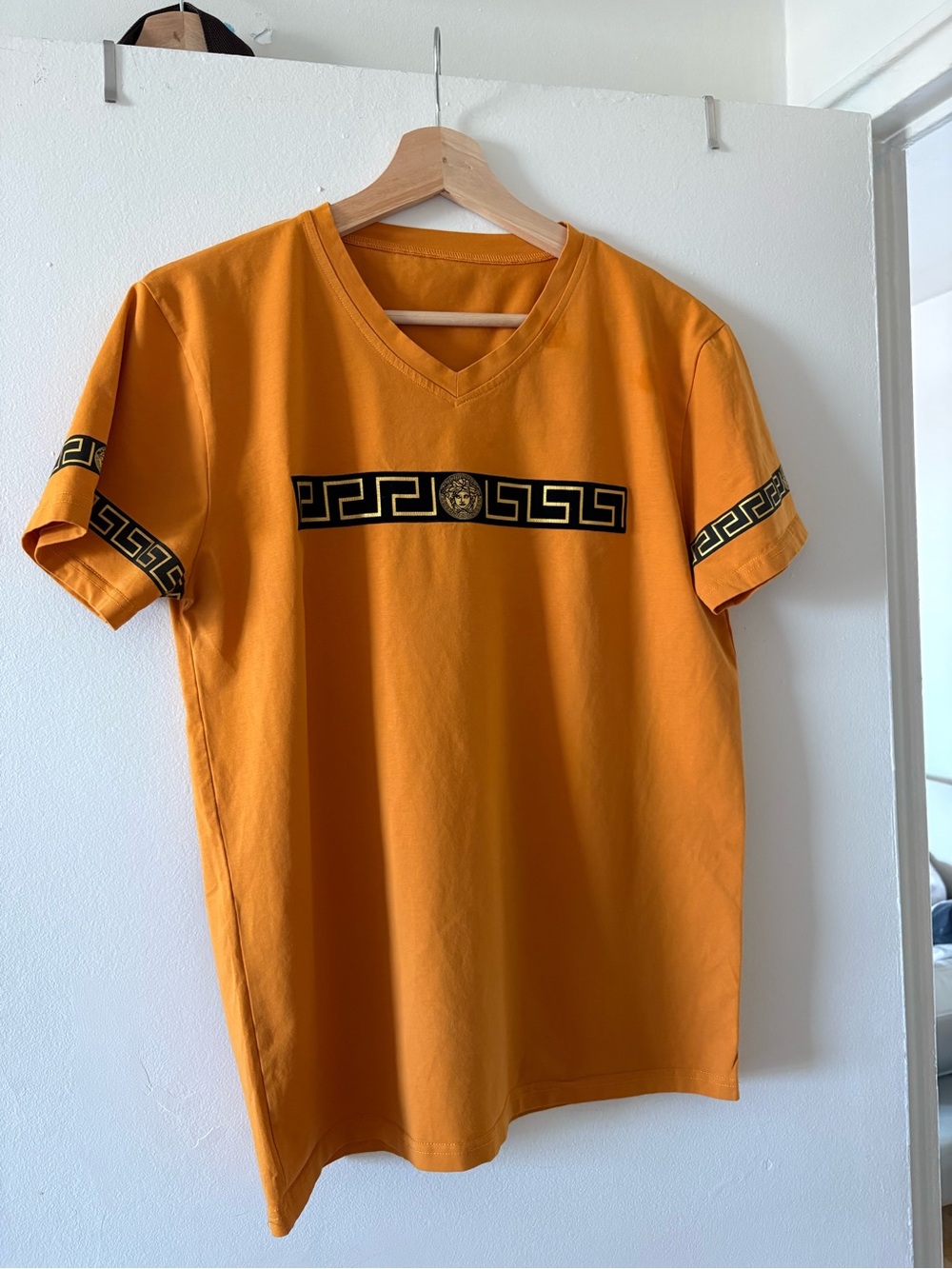Versace Orange V-Neck Tee with Black Greca Band